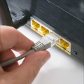 hand-inserting-ethernet-cable-router.jpg